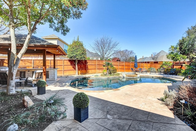 view of swimming pool with a patio, a fenced backyard, an in ground hot tub, a gazebo, and a fenced in pool