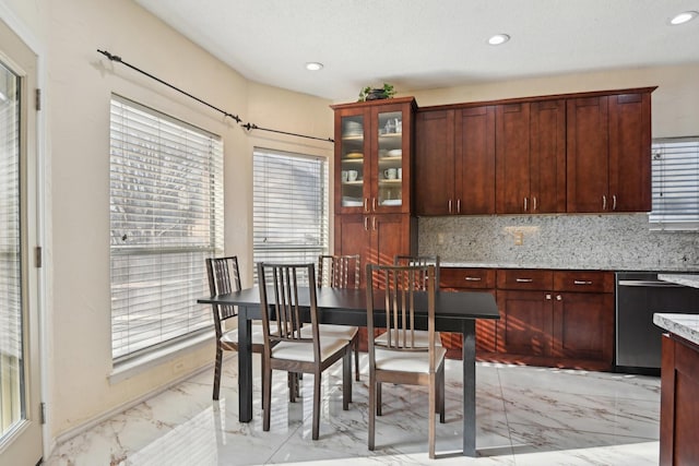 dining space featuring recessed lighting and marble finish floor