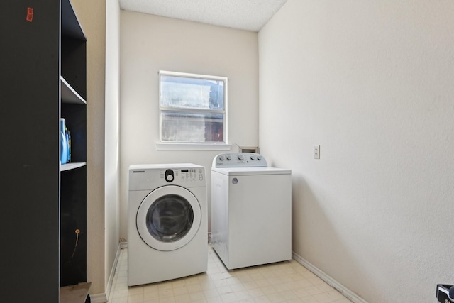 washroom with light floors, independent washer and dryer, and laundry area