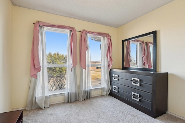 carpeted bedroom with baseboards