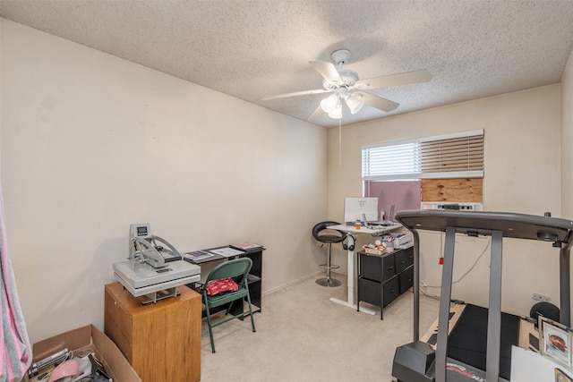 workout room with carpet floors, a textured ceiling, and ceiling fan