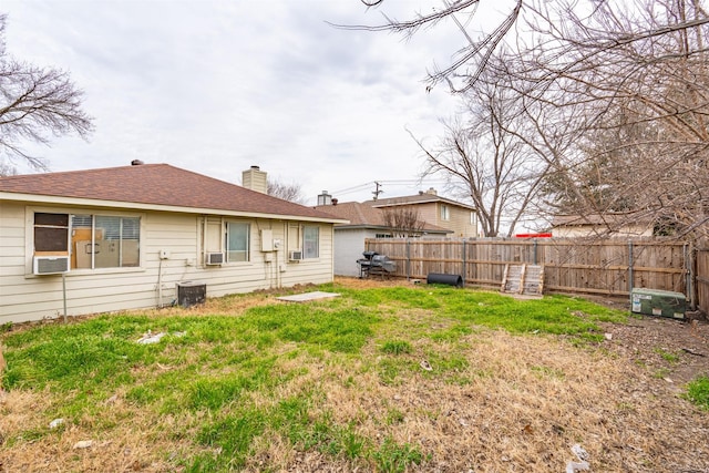 view of yard featuring cooling unit and fence private yard