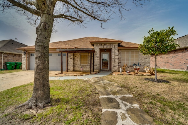 view of front facade featuring a garage, concrete driveway, and brick siding