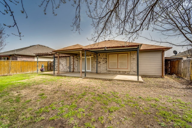 back of property featuring a fenced backyard, a yard, a patio area, a pergola, and brick siding