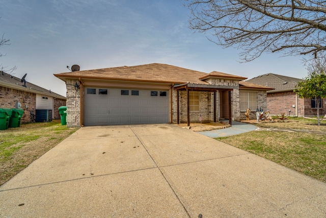 view of front of property featuring a garage, concrete driveway, and brick siding