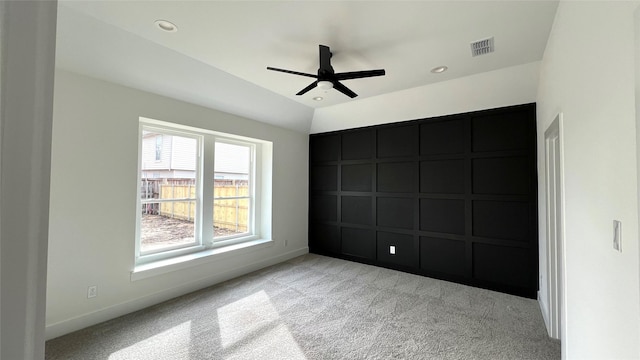 unfurnished bedroom featuring carpet floors, lofted ceiling, recessed lighting, visible vents, and baseboards