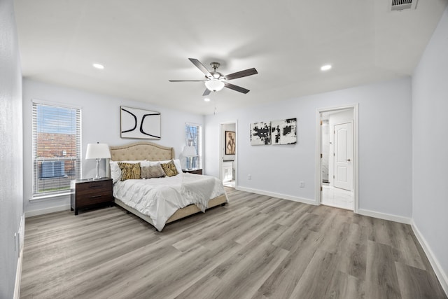 bedroom with visible vents, recessed lighting, light wood-style flooring, and baseboards