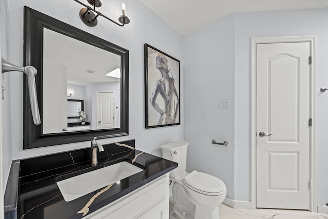 bathroom featuring marble finish floor, visible vents, toilet, vanity, and baseboards