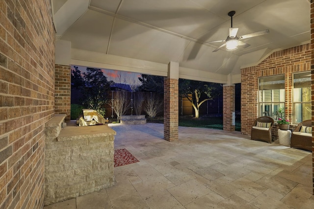 view of patio featuring fence and ceiling fan