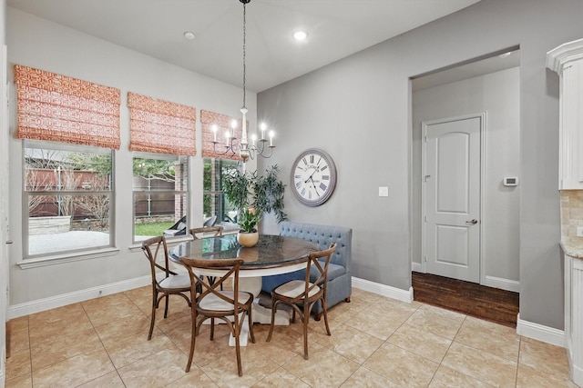 dining room featuring light tile patterned floors, baseboards, a notable chandelier, and recessed lighting