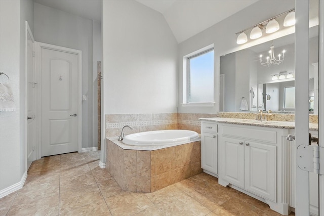 bathroom featuring a garden tub, a notable chandelier, tile patterned flooring, lofted ceiling, and vanity