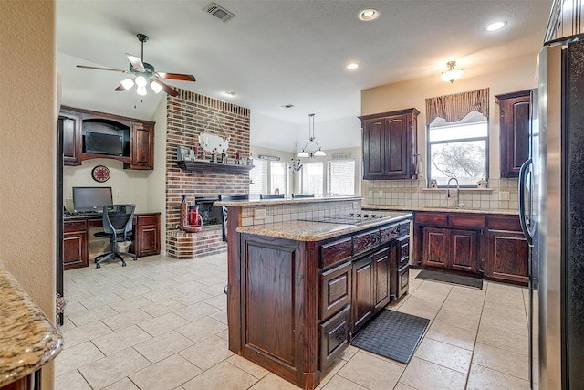 kitchen with freestanding refrigerator, visible vents, plenty of natural light, and black electric stovetop