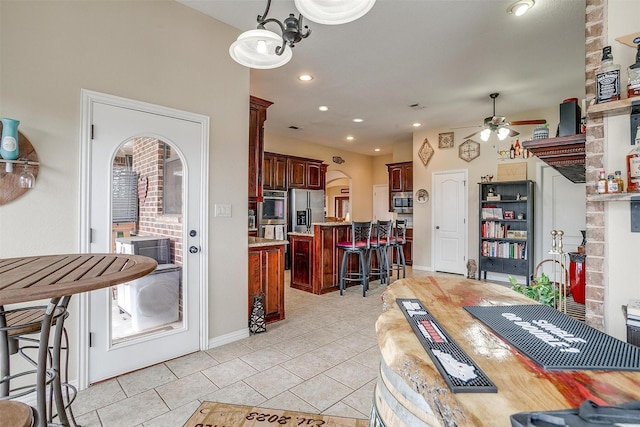 dining area featuring recessed lighting, ceiling fan, baseboards, and light tile patterned flooring