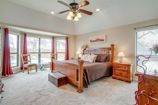 carpeted bedroom featuring recessed lighting, multiple windows, and vaulted ceiling