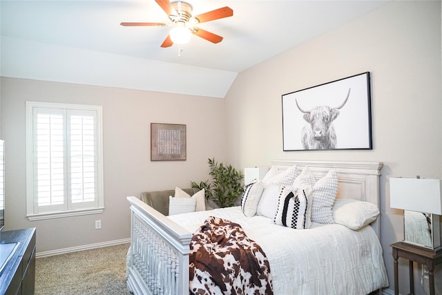 bedroom featuring light carpet, baseboards, lofted ceiling, and a ceiling fan