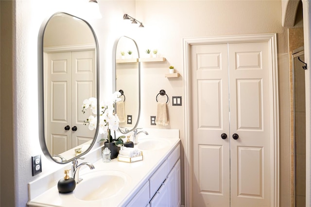 bathroom featuring double vanity and a sink