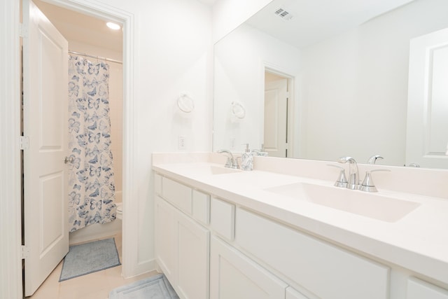 2609 Muirwood Way, Celina, TX 75009 - full bathroom with toilet, double vanity, a sink, and visible vents