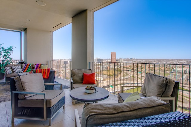 balcony featuring a view of city and an outdoor hangout area