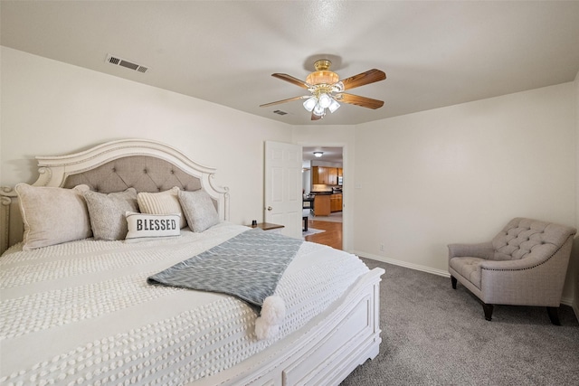 bedroom featuring carpet floors, visible vents, baseboards, and a ceiling fan