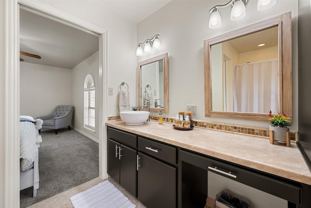 bathroom with ceiling fan, tile patterned flooring, and vanity