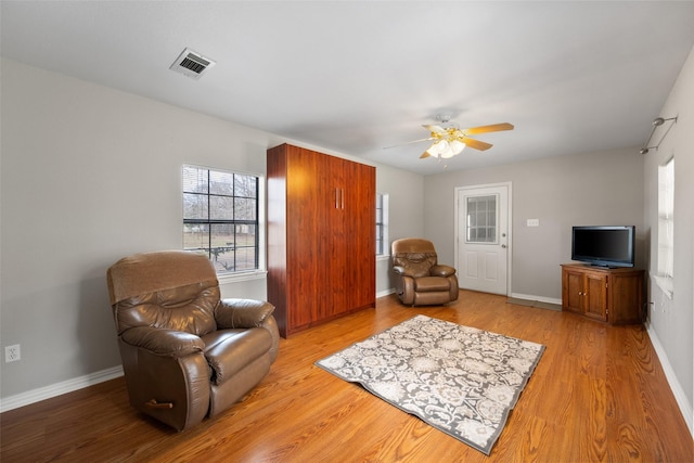 116 Walker Trce, Streetman, TX 75859 - living area featuring a ceiling fan, healthy amount of natural light, light wood finished floors, and baseboards