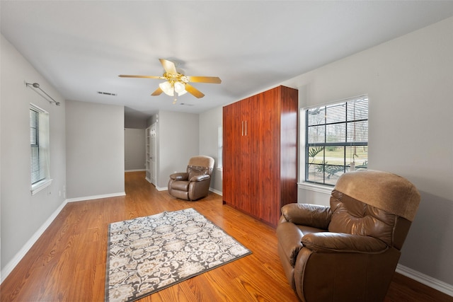 116 Walker Trce, Streetman, TX 75859 - sitting room with light wood-style flooring, healthy amount of natural light, a ceiling fan, and baseboards