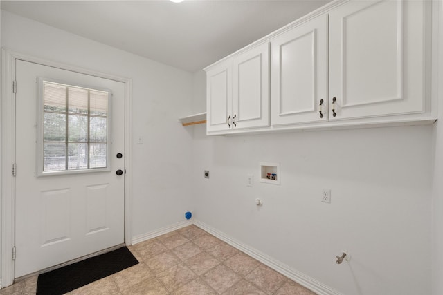 clothes washing area featuring hookup for a gas dryer, washer hookup, cabinet space, and hookup for an electric dryer