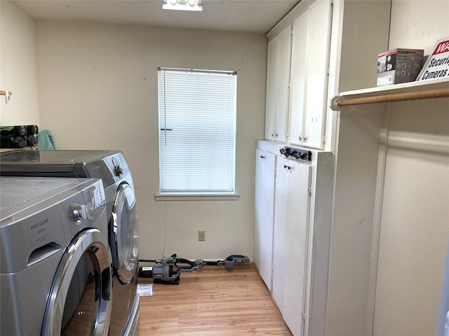 806 Robindale Ln, Fairfield, TX 75840 - laundry area featuring cabinet space, washer and dryer, and light wood-style floors