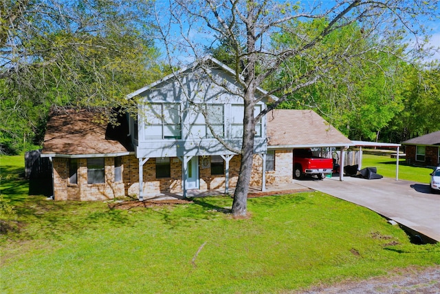 806 Robindale Ln, Fairfield, TX 75840 - view of front of property with driveway, a front lawn, brick siding, a carport, and covered porch
