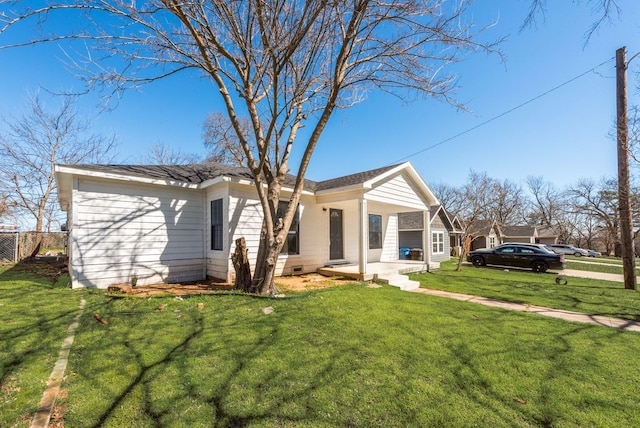 view of home's exterior with crawl space, covered porch, fence, and a yard