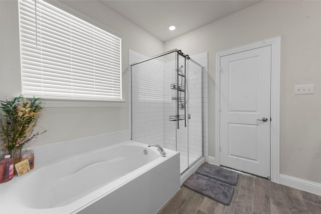 3512 Tunnel Ave, Aubrey, TX 76227 - bathroom with wood finished floors, a garden tub, a stall shower, recessed lighting, and baseboards