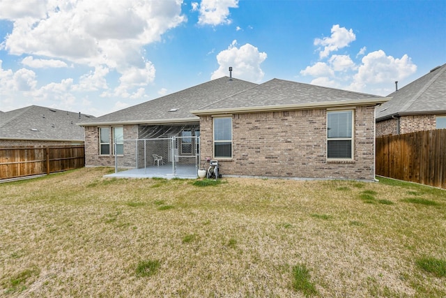 3512 Tunnel Ave, Aubrey, TX 76227 - back of house with brick siding, a patio area, and a shingled roof