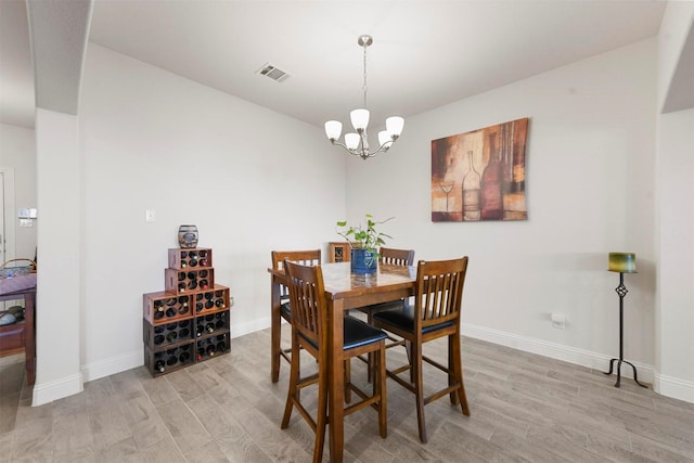 3512 Tunnel Ave, Aubrey, TX 76227 - dining space featuring light wood-style flooring, a chandelier, and baseboards