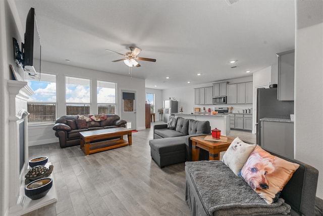 3512 Tunnel Ave, Aubrey, TX 76227 - living area featuring a ceiling fan, light wood-style flooring, baseboards, and recessed lighting