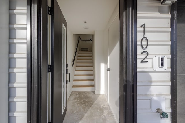 hallway featuring stairs