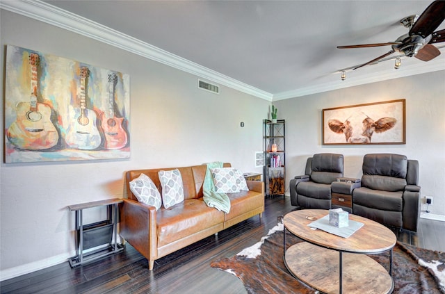 living room featuring wood finished floors, visible vents, and crown molding