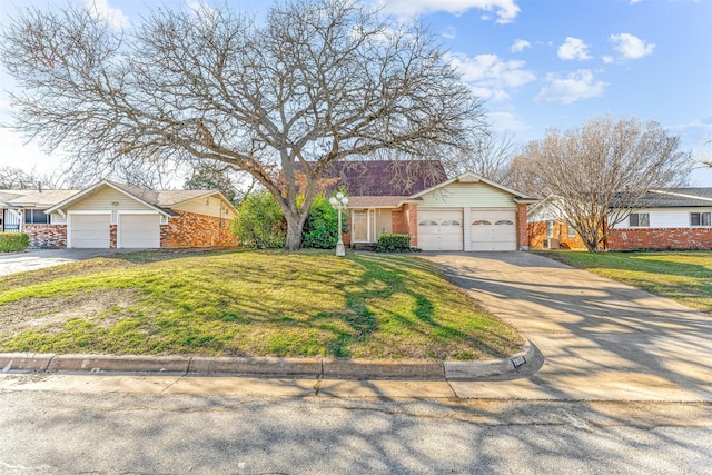 ranch-style home featuring driveway, a front lawn, and brick siding