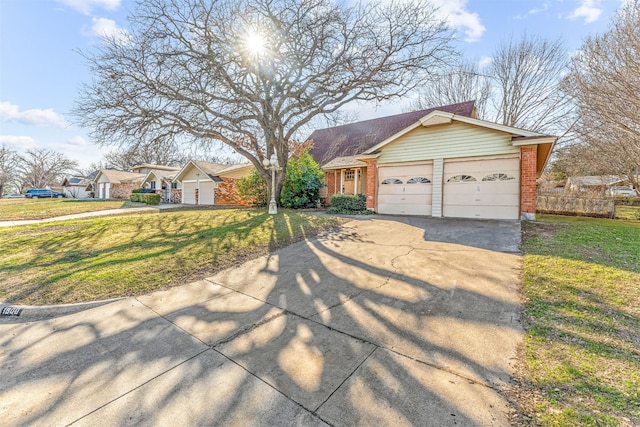 view of front of property with a front yard, concrete driveway, and brick siding