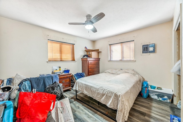 bedroom with ceiling fan and wood finished floors