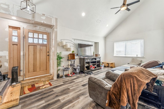 living area featuring high vaulted ceiling, a ceiling fan, recessed lighting, and wood finished floors