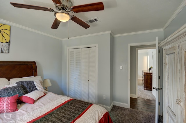 bedroom featuring ornamental molding, a closet, and visible vents