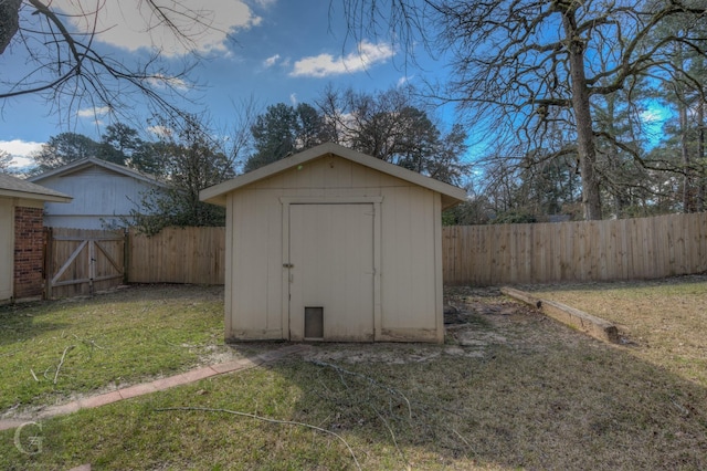 view of shed with a fenced backyard