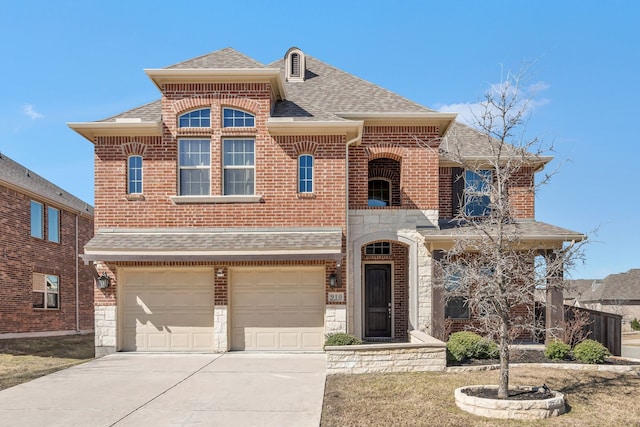 view of front of home with an attached garage, a shingled roof, brick siding, stone siding, and concrete driveway