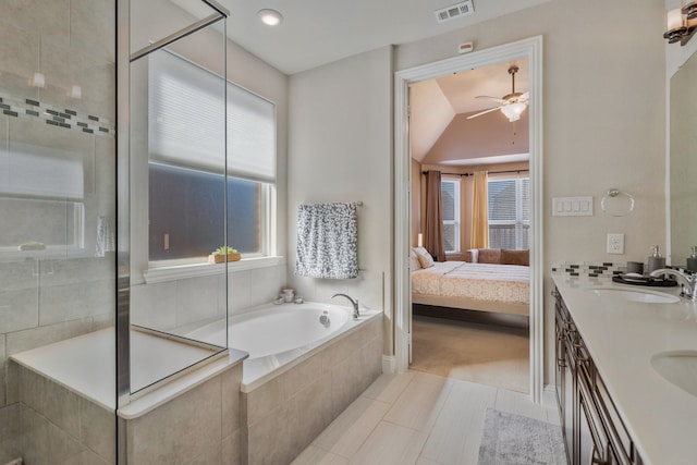 full bath with visible vents, ensuite bathroom, a sink, a tile shower, and a bath