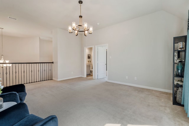 sitting room with light carpet, visible vents, a notable chandelier, and lofted ceiling