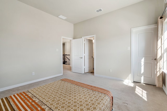 unfurnished bedroom featuring carpet, visible vents, and baseboards