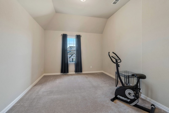 exercise room featuring lofted ceiling, carpet, visible vents, and baseboards