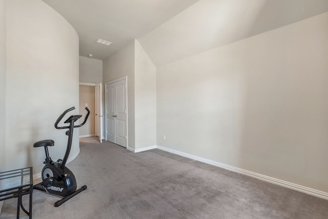 exercise area with carpet floors and baseboards