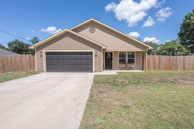 ranch-style house with a garage, driveway, a front yard, and fence