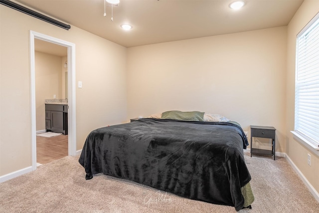 bedroom with light carpet, baseboards, and recessed lighting